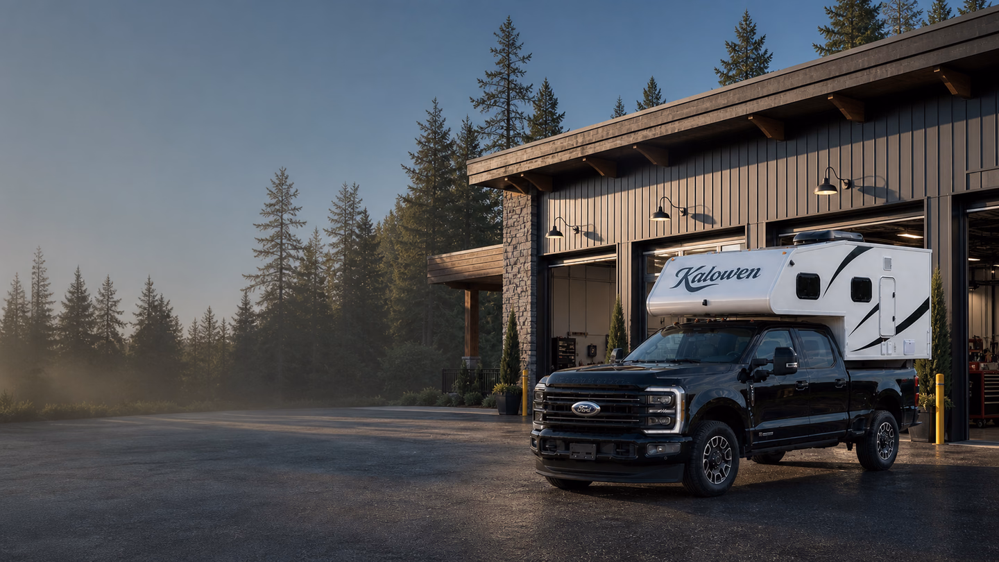 Kalowen 250 truck camper outside a professional dealership service facility