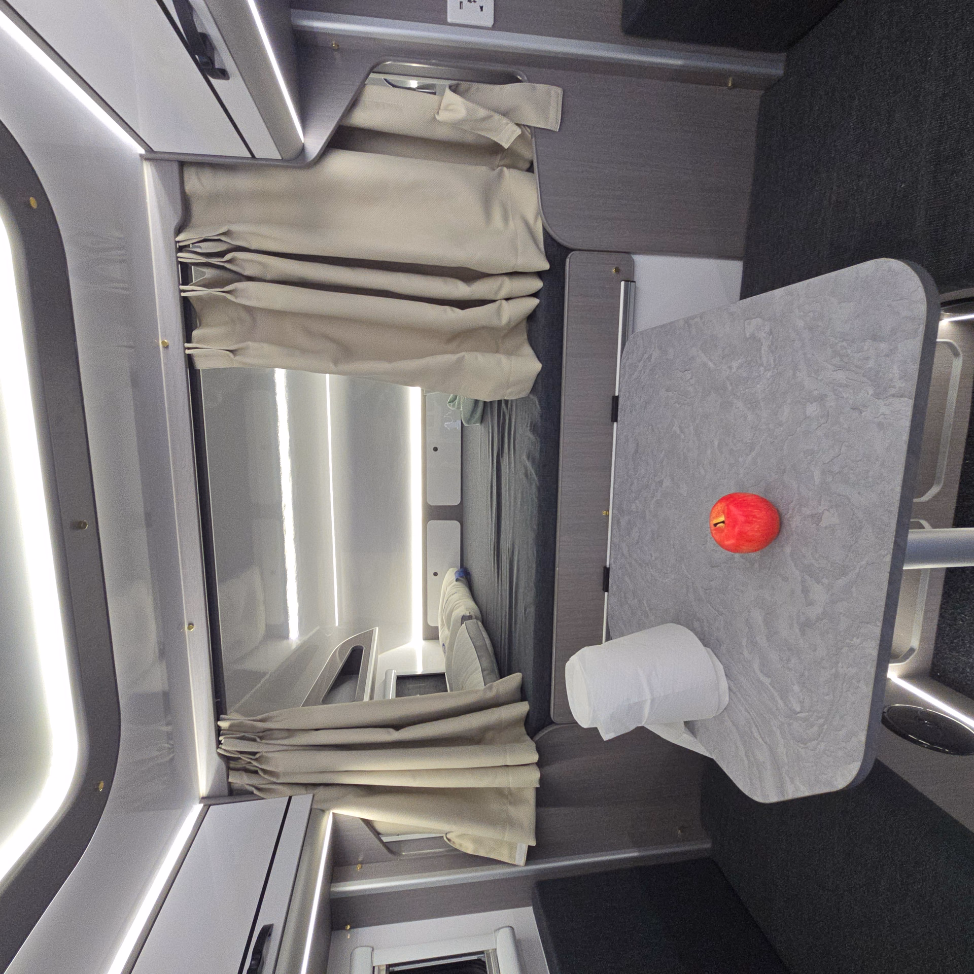 Kalowen camper dinette and sleeping area with integrated lighting