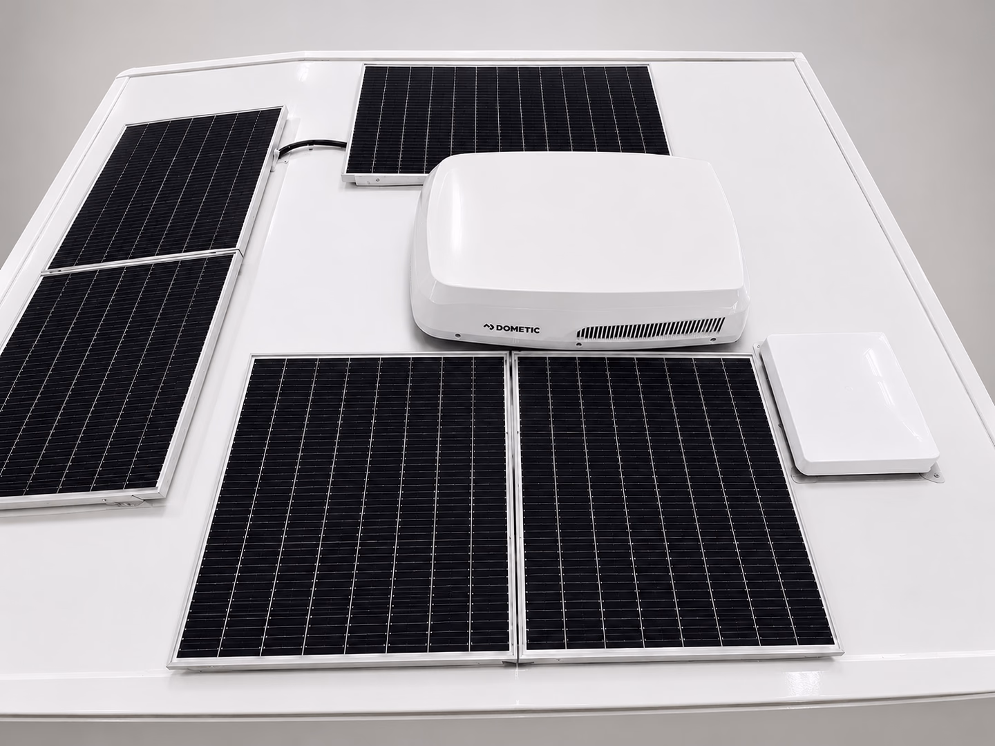 Dometic rooftop air conditioner installed among solar panels