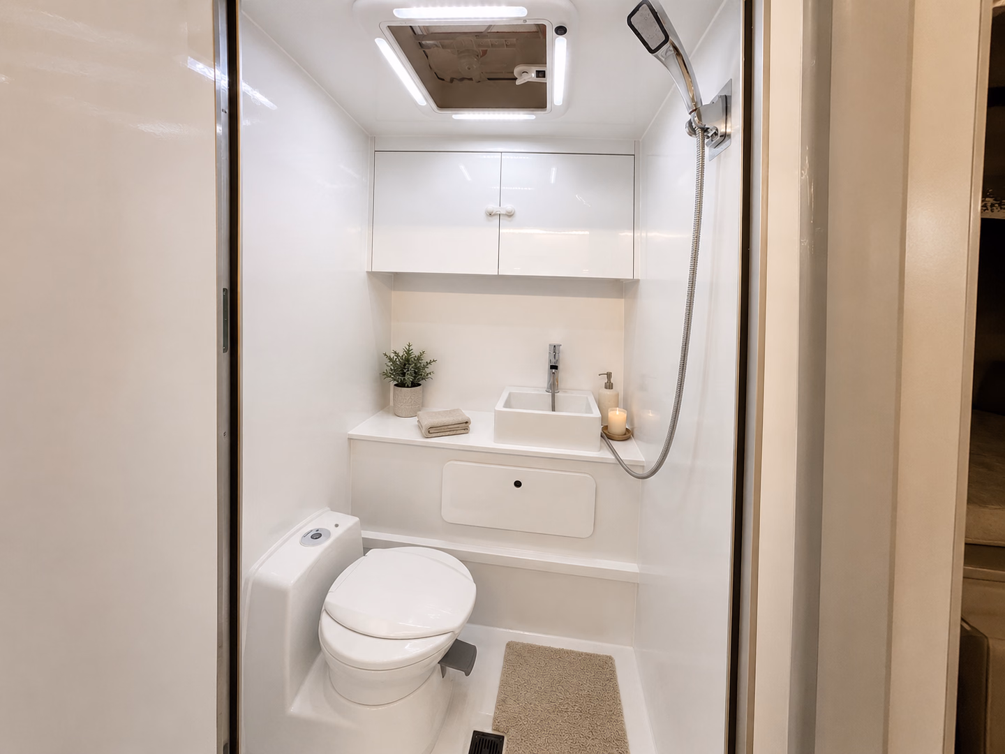 Kalowen 250 wet bath with toilet, shower, and sink.